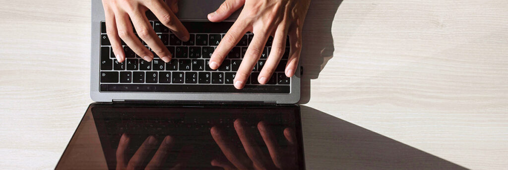 Contact us, hands typing